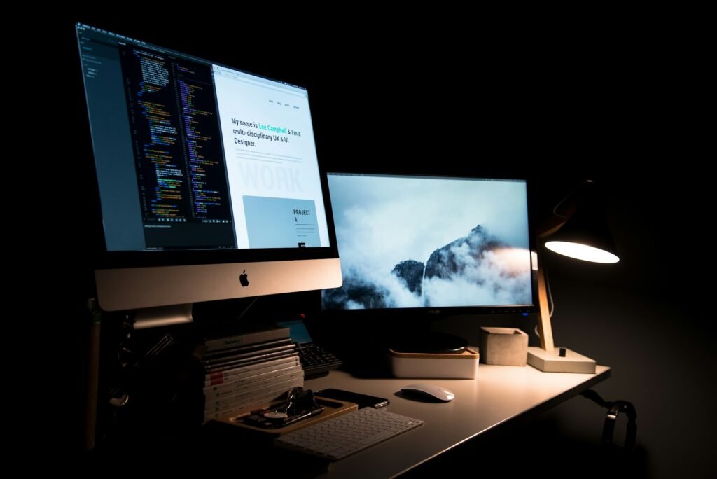 Developer workspace with laptop and monitors